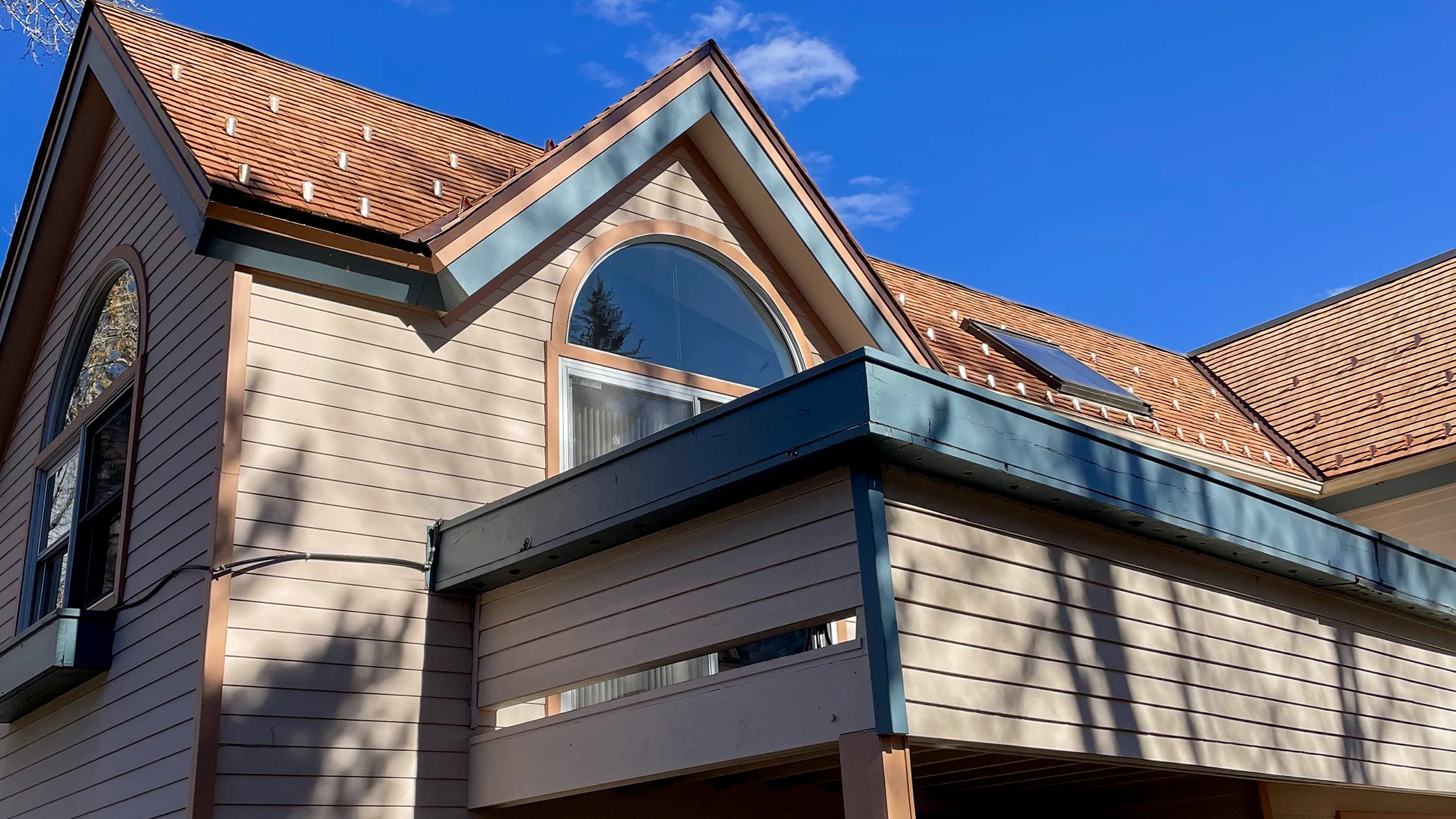 Completed wood shingle roof replacement on a historic residence