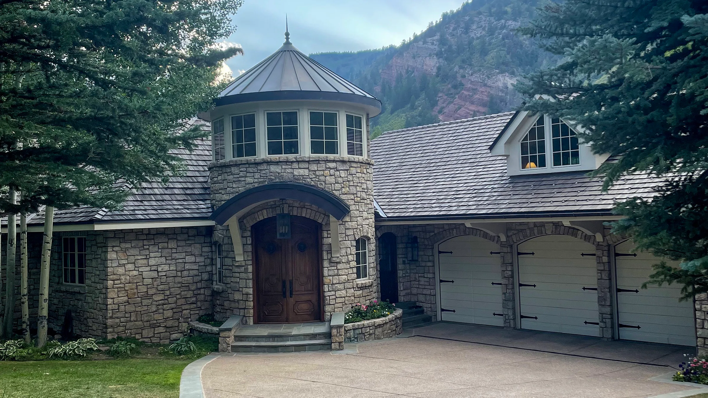 Completed synthetic shake roof on a stone mountain residence